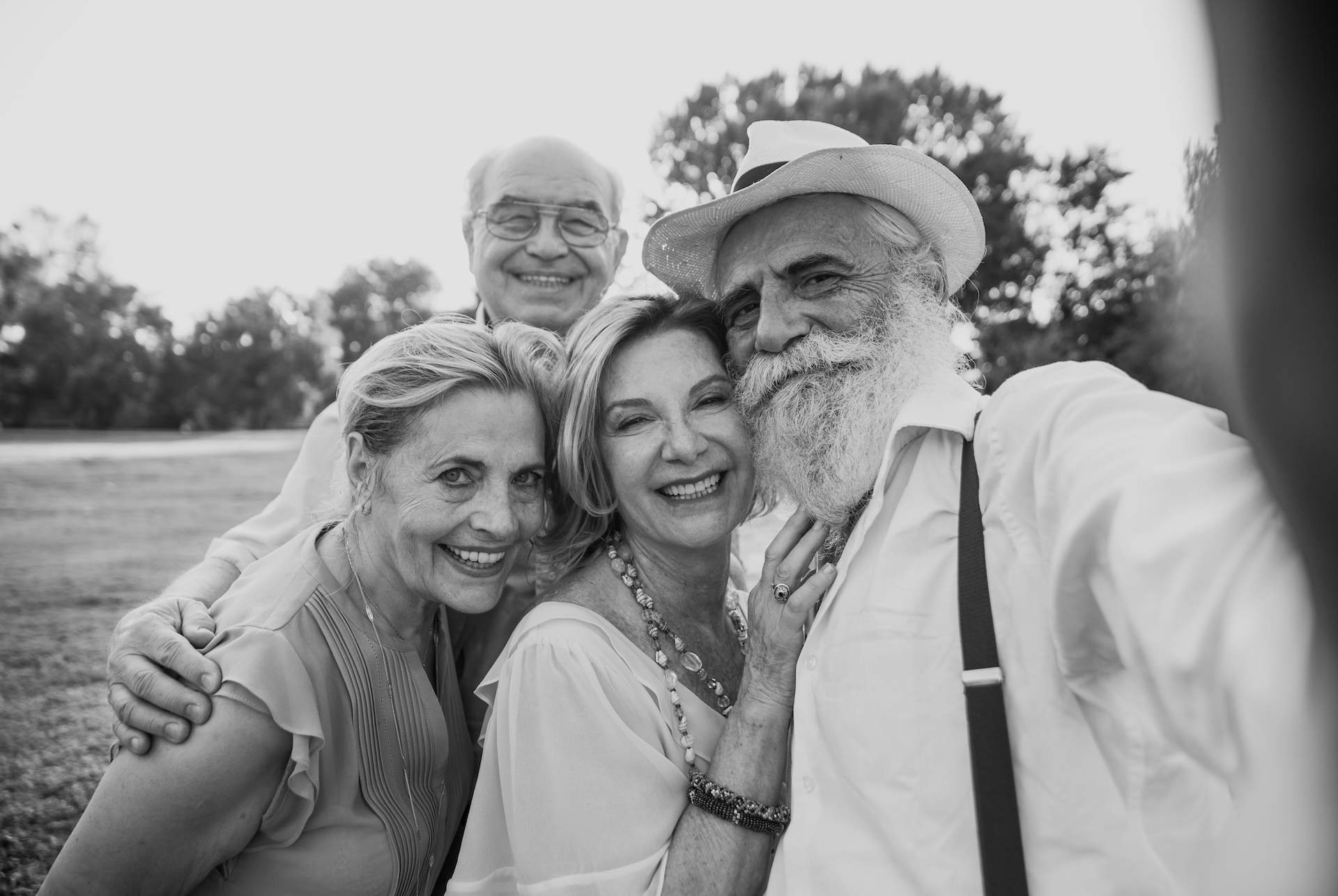 Group of seniors making a picnic at the park and having fun